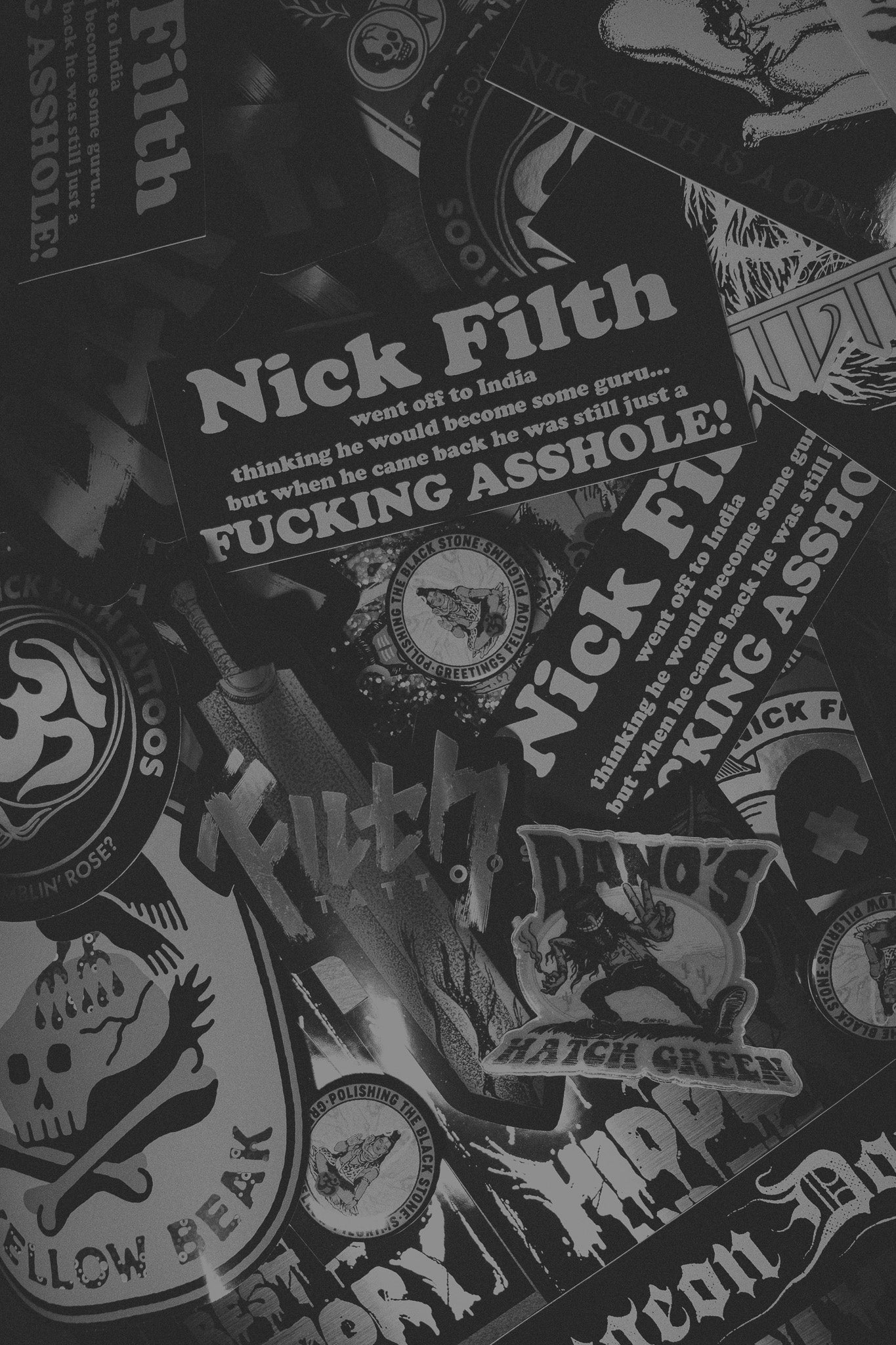 A pile of stickers created by the tattoo artist Nick Filth
