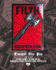 Enamel axe pin with spider web design and 'NICKFILTH.COM' text on a red and black background.