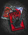 Sticker with a black cat design and 'NICKFILTH.COM' text on a dark textured background