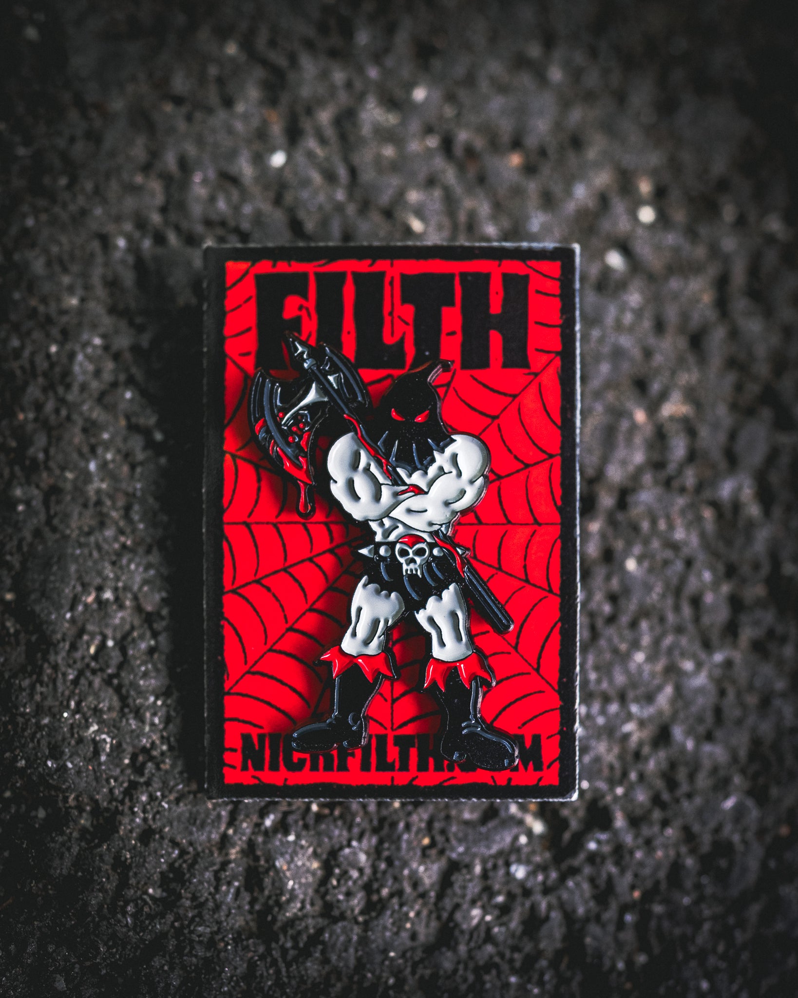 Pin with a graphic design on a red background, featuring text and a stylized figure.