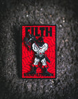 Pin with a graphic design on a red background, featuring text and a stylized figure.
